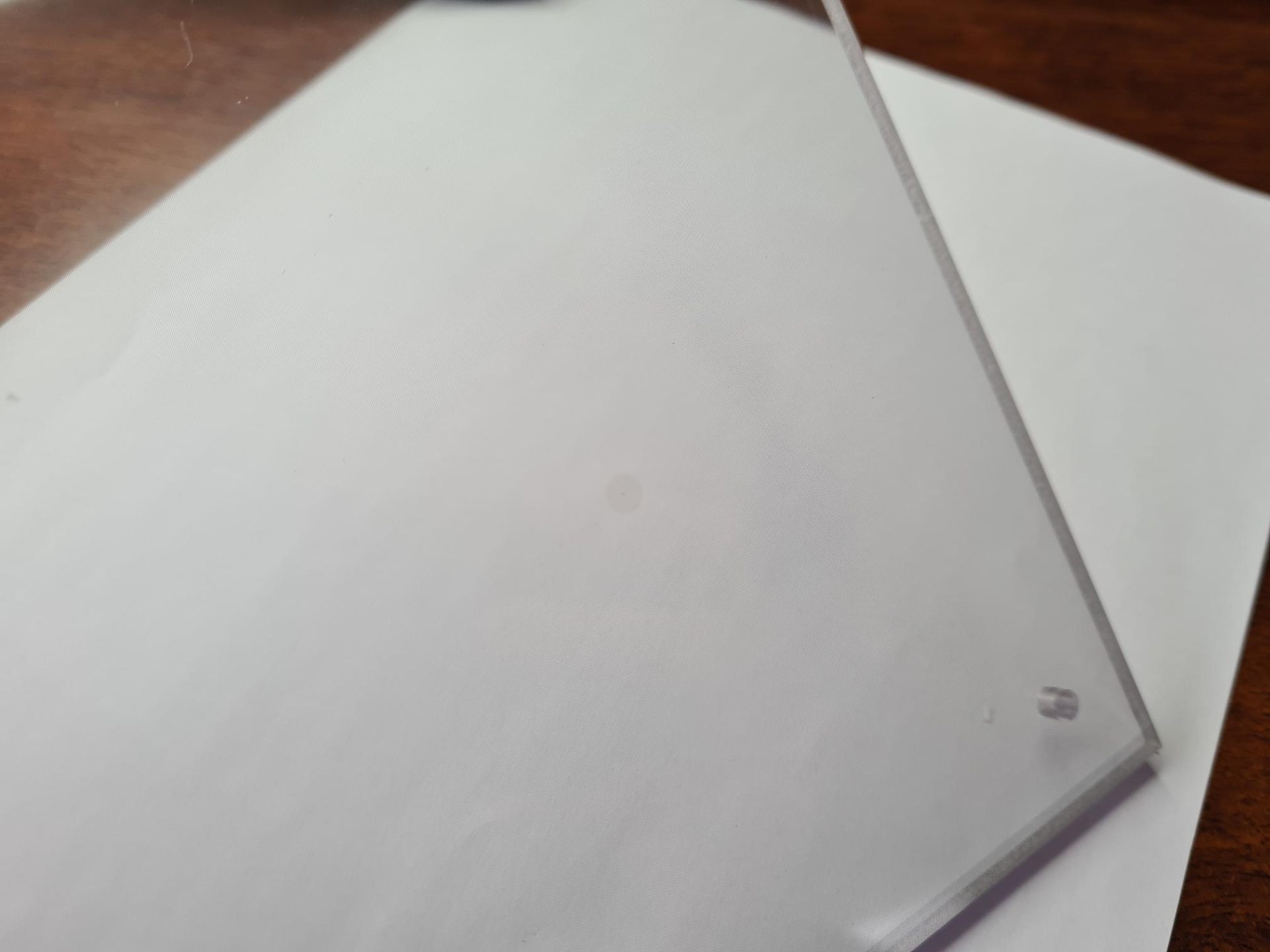 Bubble defect trapped in a laminated EMI shielding window