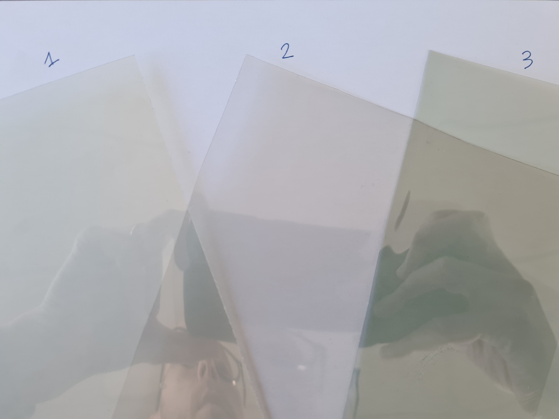 Comparison of three different transparent EMI shielding films with varying transparency levels