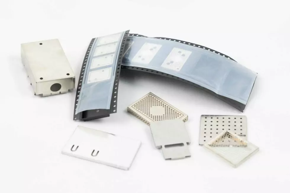 Various PCB EMI shielding covers, clips, and belt assemblies with reel packaging